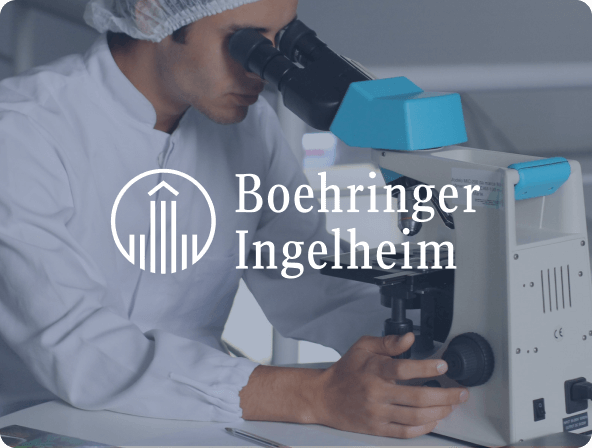 Docter examining specimen in lab with boehringer Ingelheim logo overlay